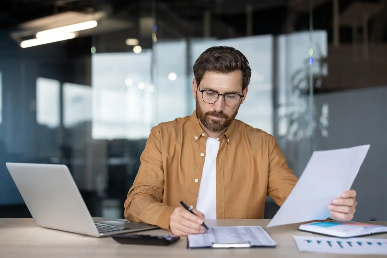 Man looking at papers infront of him