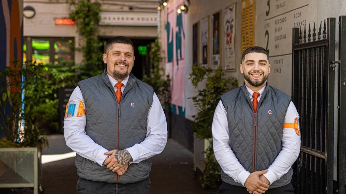 Two security men smiling